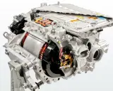 Cutaway view of an electric car motor, showing internal components like the rotor, stator, and power electronics.