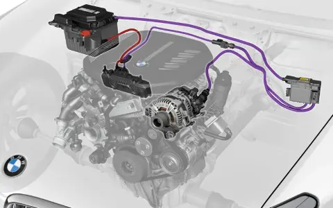 Schema di un sistema mild hybrid BMW: batteria, alternatore e centralina. Valuta i mild hybrid vantaggi e svantaggi per un'auto più efficiente.