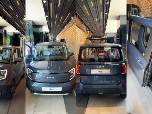 Tre Kia Ray, un'auto elettrica compatta, esposte in un salone moderno. La Kia Ray è pronta per il futuro.