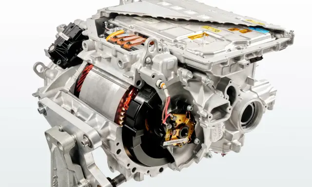 Cutaway view of an electric car motor, showing internal components like the rotor, stator, and power electronics.